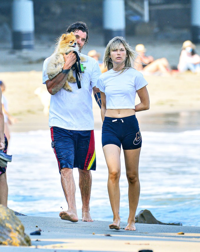 Gavin Rossdale is spotted on the beach with a mystery woman and his pooch