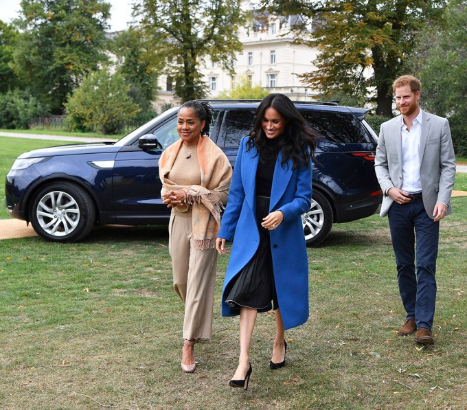 Meghan Markle & Prince Harry walk with Meghan’s mother Doria Ragland