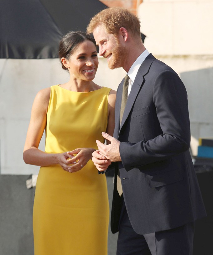 Prince Harry & Meghan Markle smile at each other in London