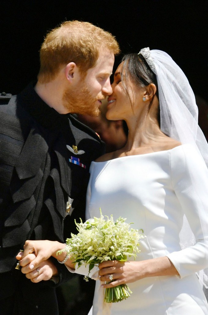 Meghan Markle & Prince Harry share a kiss at their wedding