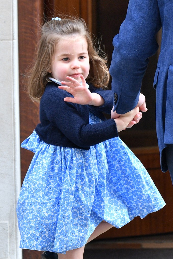 Princess Charlotte waves to cameras