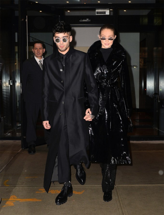 Zayn Malik & Gigi Hadid wearing matching black trench coats