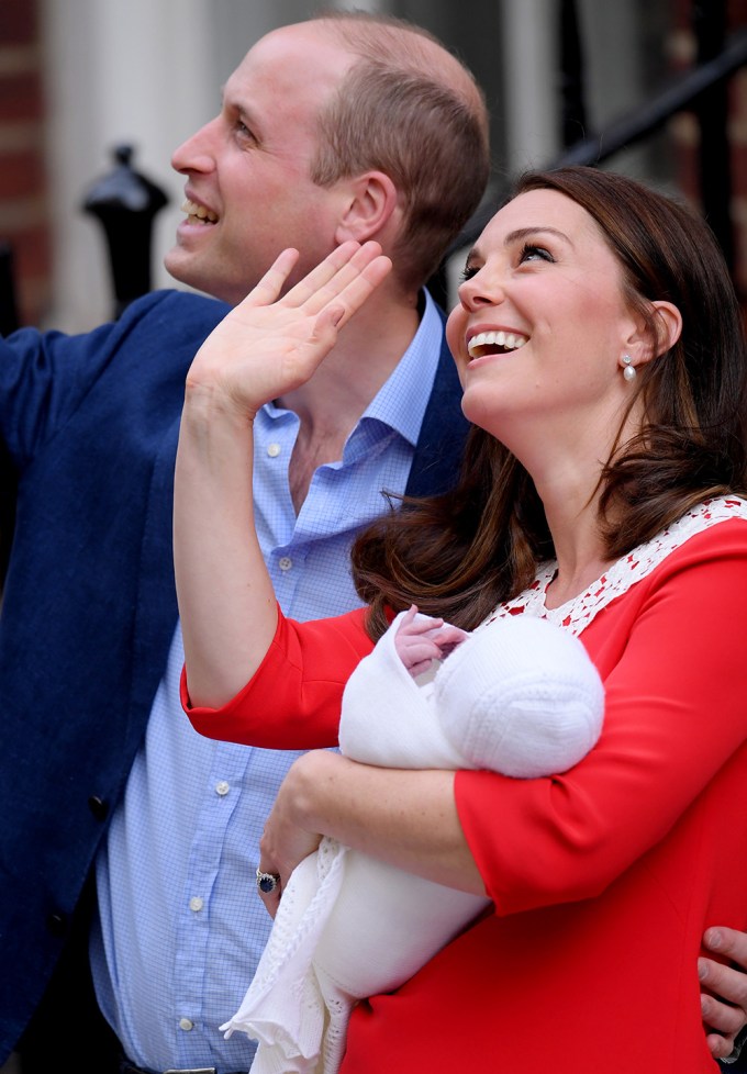 Prince William and Duchess Catherine wave after introducing Prince Louis