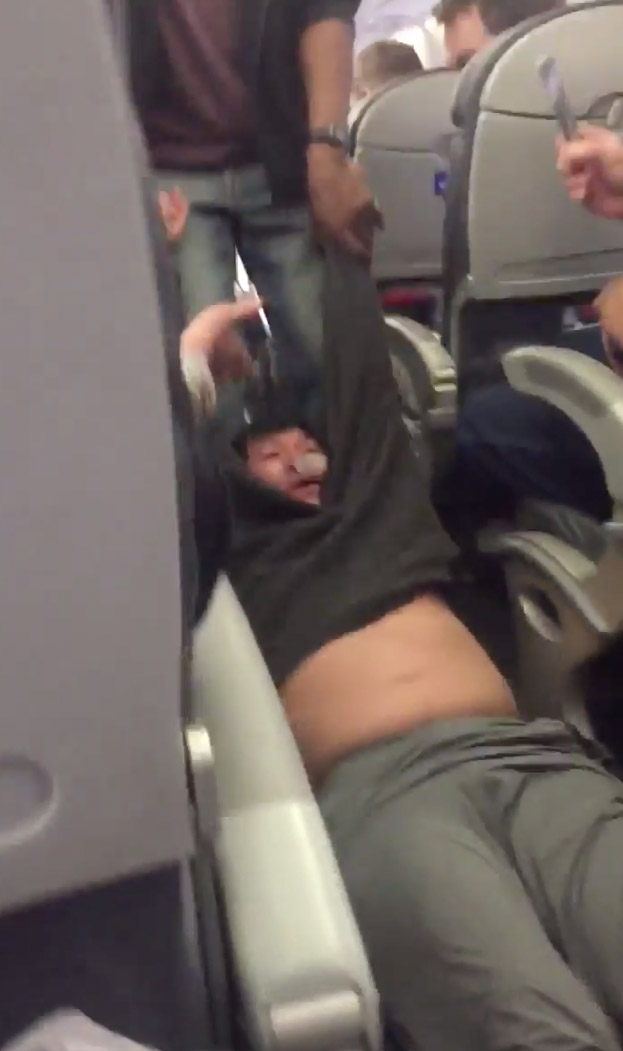 United-Airlines-Shocking-Video-Passenger-Bloodied-Disoriented-19