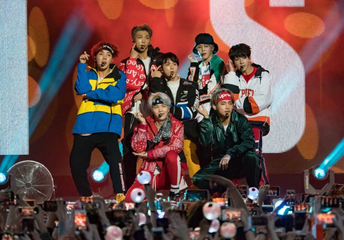 BTS Pose Onstage During A Show