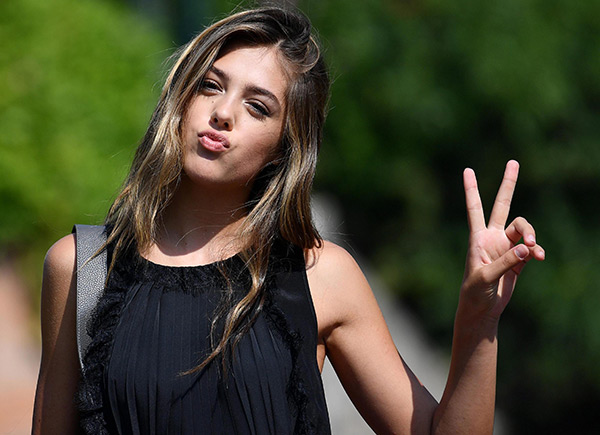 Sistine Stallone Flashes The Peace Sign