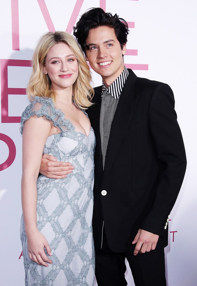 Lili Reinhart and Cole Sprouse pose on the red carpet