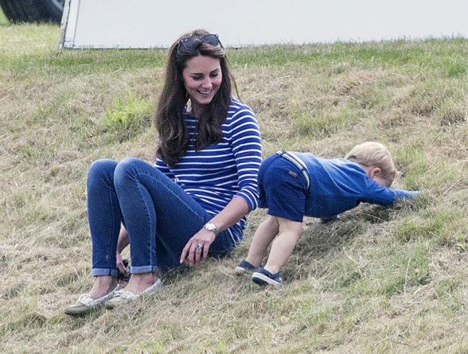 Prince George and Kate Middleton playing on the grass