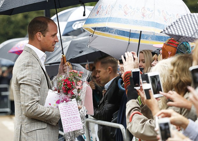 Prince William greets a crowd of people