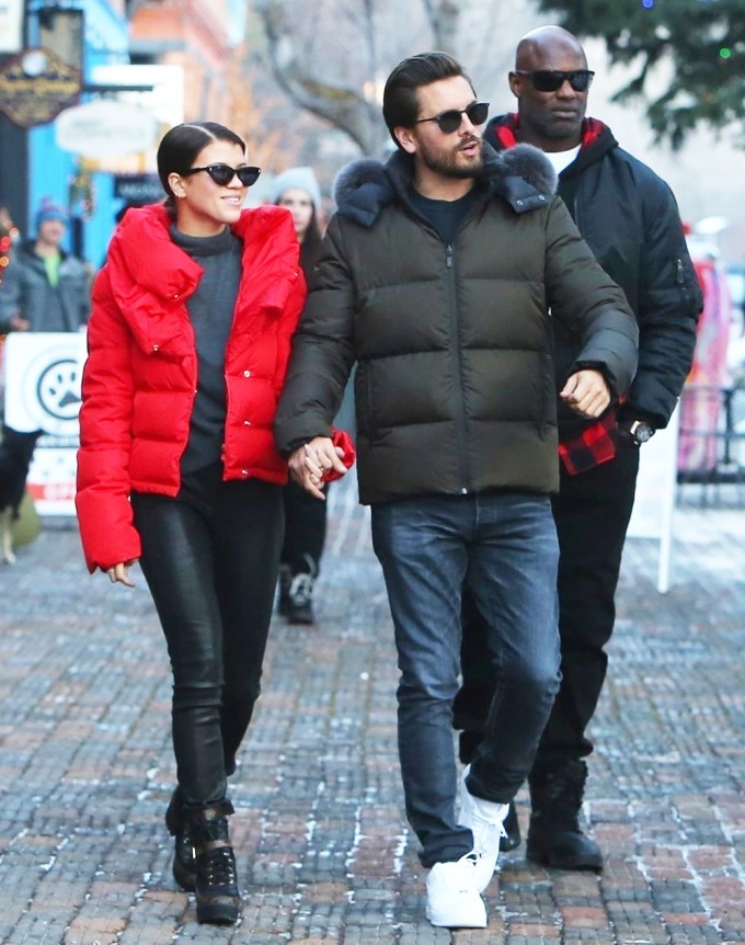 Scott Disick & Sofia Richie Wear Puffer Jackets And Hold Hands