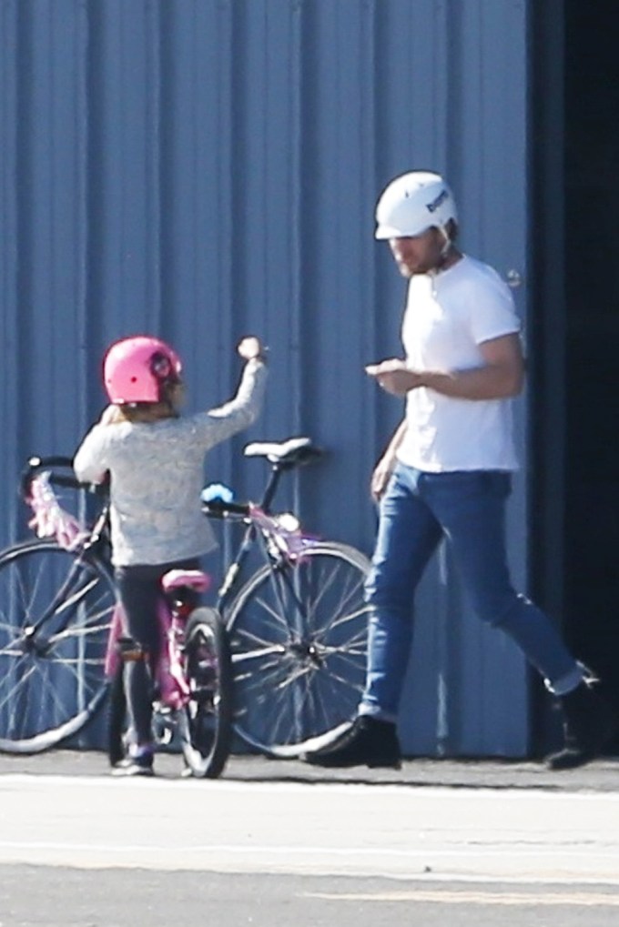 Ewan McGregor takes daughter Anouk for a bike ride at the Santa Monica airport
