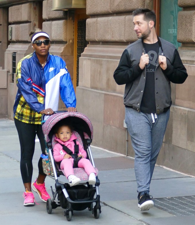 Serena Williams, her husband Alexis Ohanian, and their daughter Olympia going for a walk