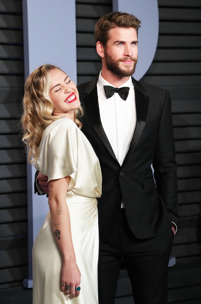 Miley Cyrus & Liam Hemsworth Smiling On Red Carpet