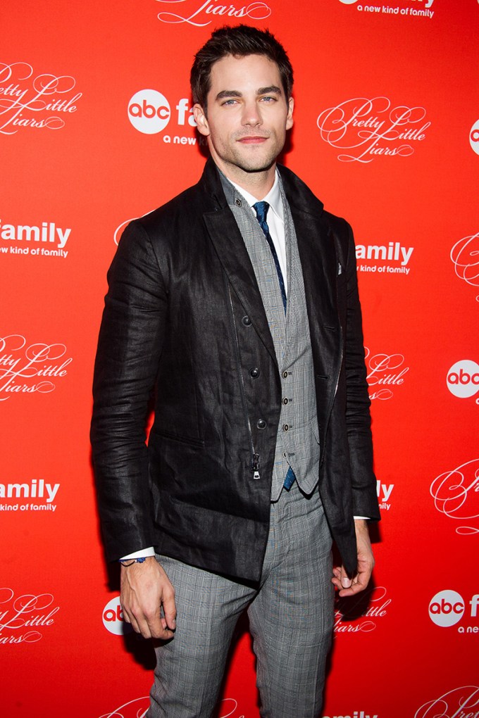 Brant Daugherty in a coat and suit