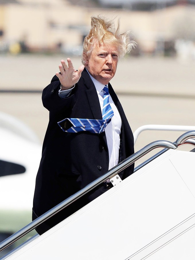 Donald Trump Waves As He Boards An Airplane