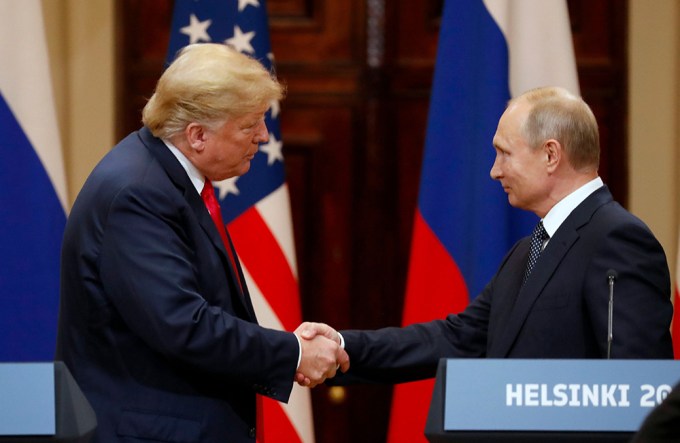 Donald Trump Shakes Hands With Vladimir Putin