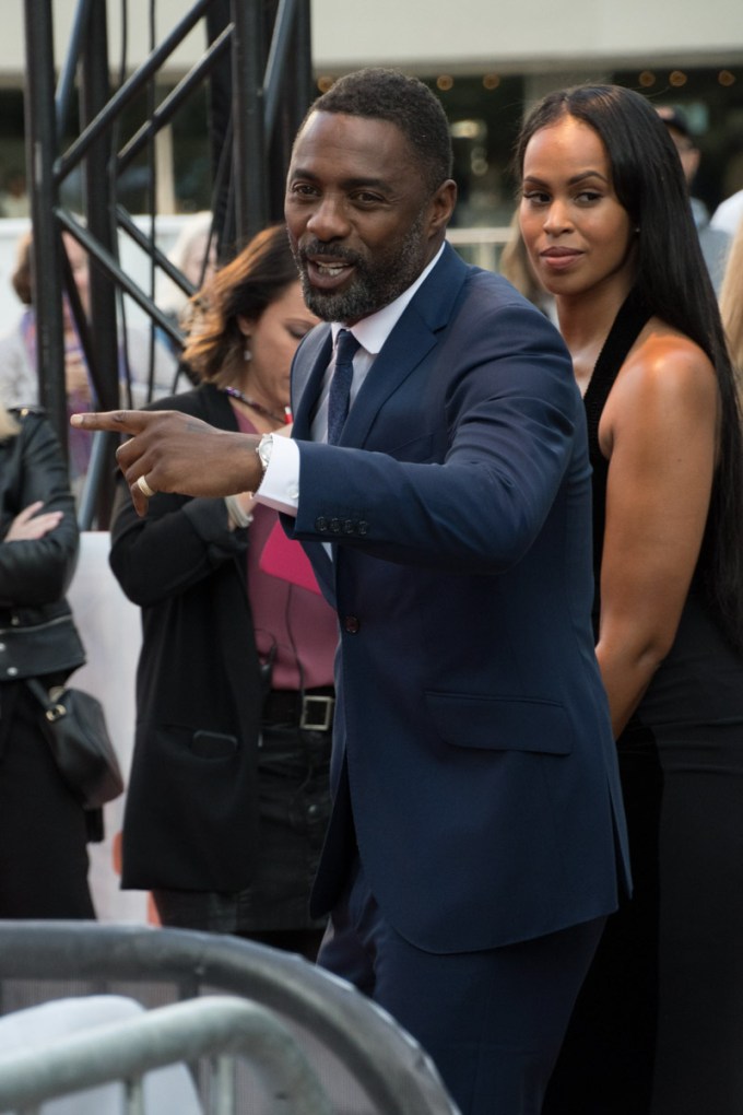 Idris Elba & Sabrina Dhowre greet people
