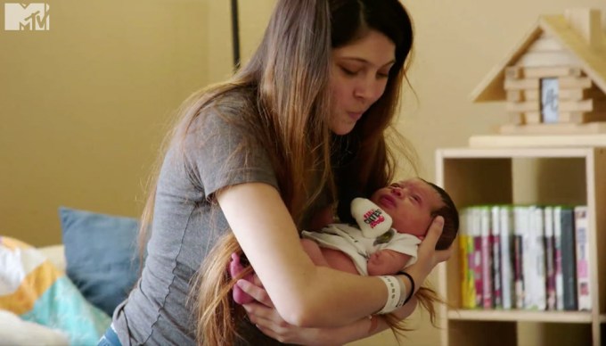 Brianna Jaramillo holding her baby during a scene