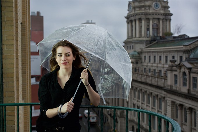 Clara McGregor poses in the rain
