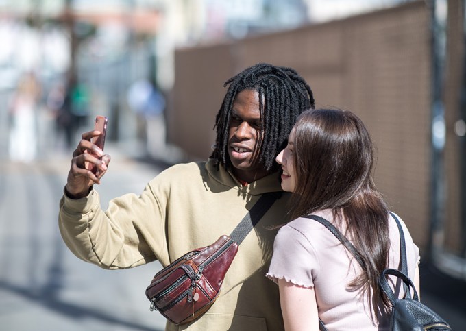 Daniel Caesar takes a photo with someone