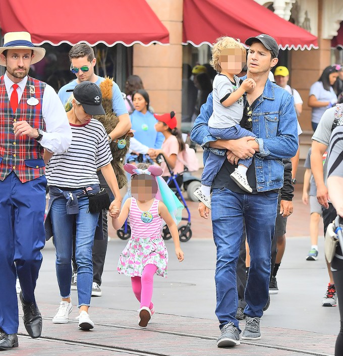 Ashton Kutcher Carries Son Dimitri Around Disneyland