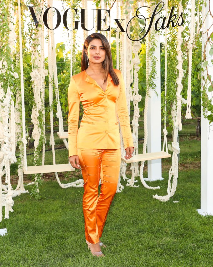 Priyanka Chopra in an orange pantsuit