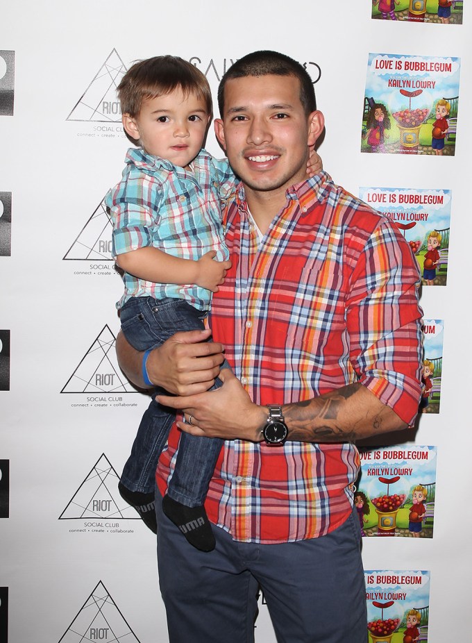 Javi Marroquin holds son Lincoln at a book launch
