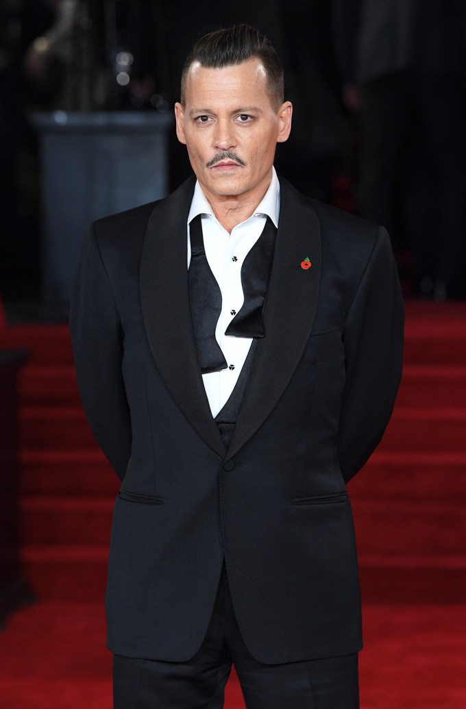 Johnny Depp poses in a tuxedo