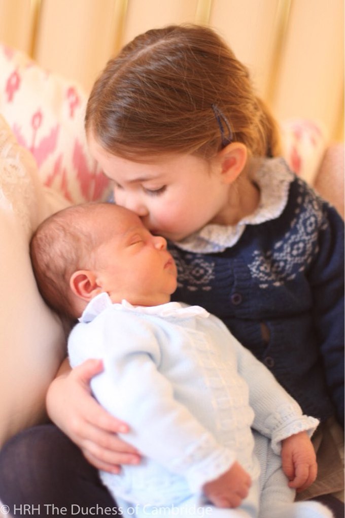 Prince Louis Arthur Charles as a newborn getting a kiss from Princess Charlotte