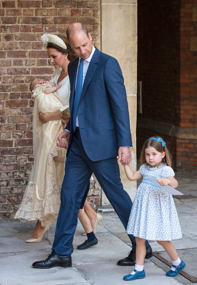 Prince Louis Arthur Charles in his mom’s arms as Princess Charlotte looks on.