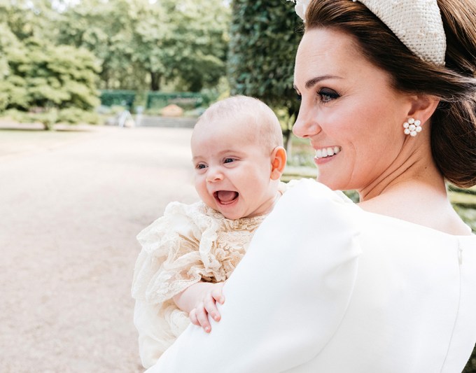 Prince Louis Arthur Charles held by mom Kate Middleton after his christening.