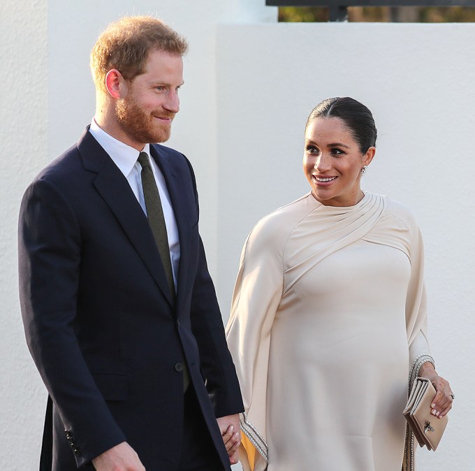 A Pregnant Meghan Markle Holds Hands With Prince Harry