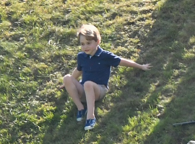 Prince George sitting outside