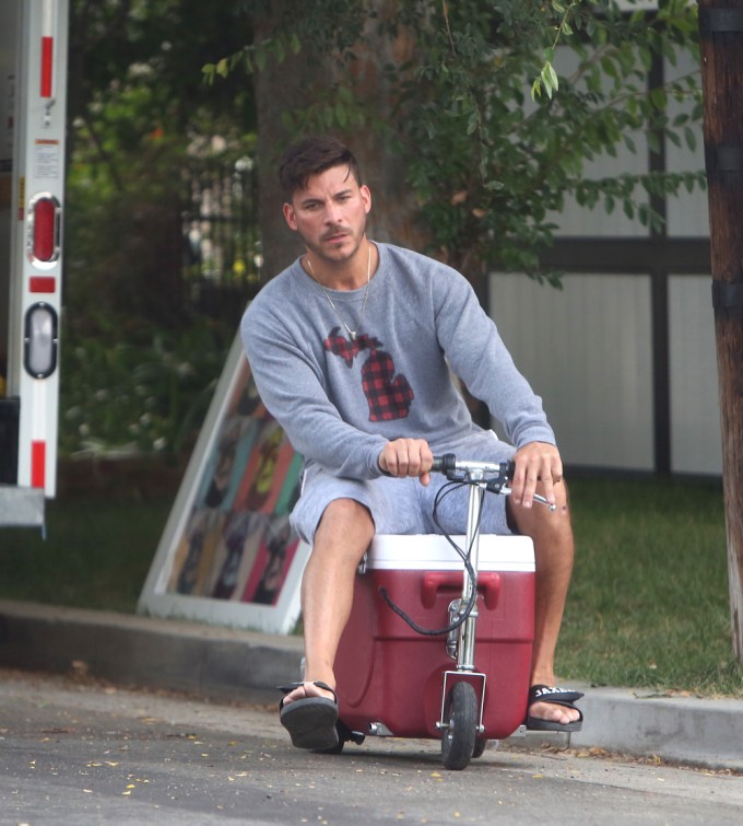 Jax Taylor rides a customized ice chest scooter