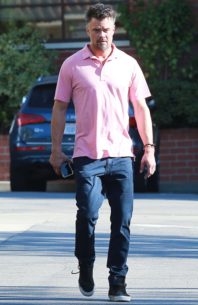 Josh Duhamel rocks a pink polo while out