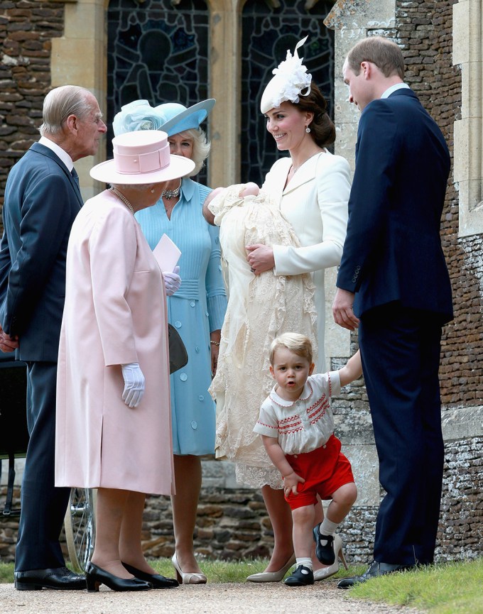 Prince George looks at a camera