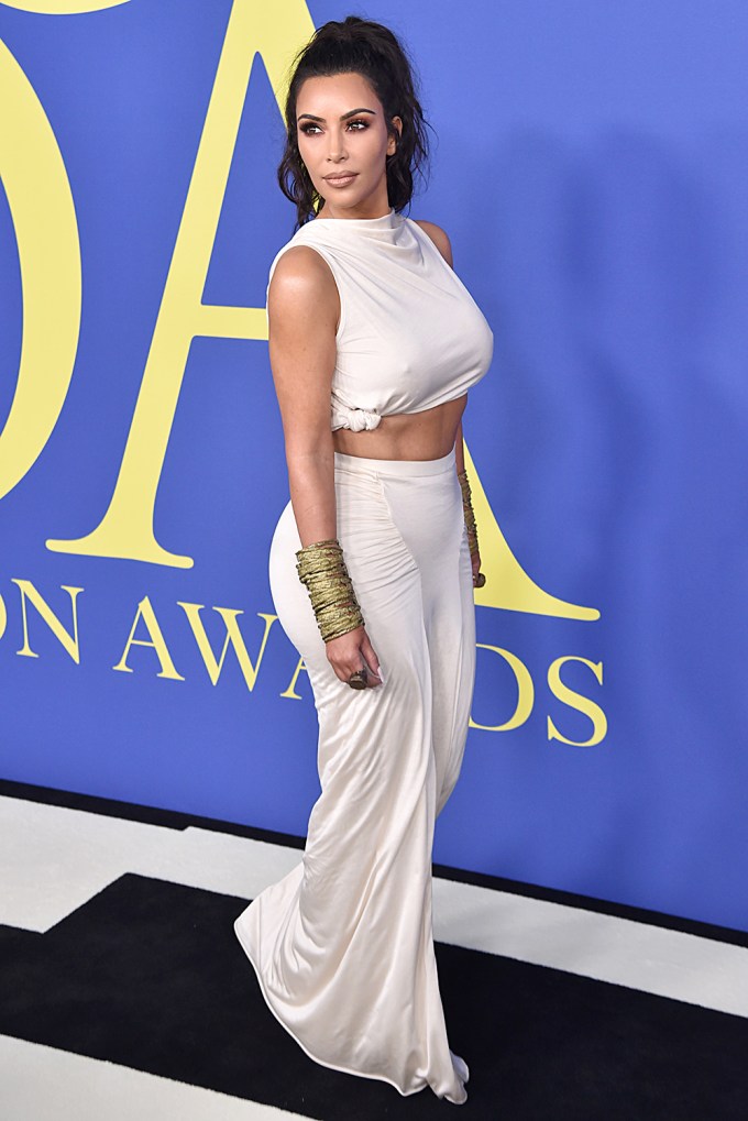 Kim Kardashian in a matching crop top and skirt at the CFDA Awards