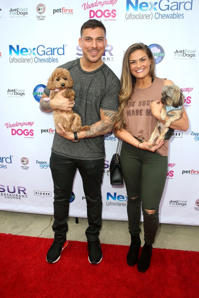 Jax Taylor & Brittany Cartwright with their puppies at a Vanderpump Dogs Event