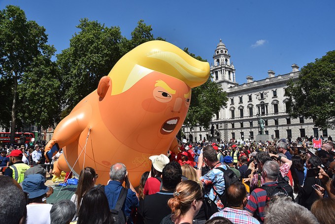 National Rally Against Trump’s Visit To London — See Photos Of The Trump Baby Blimp