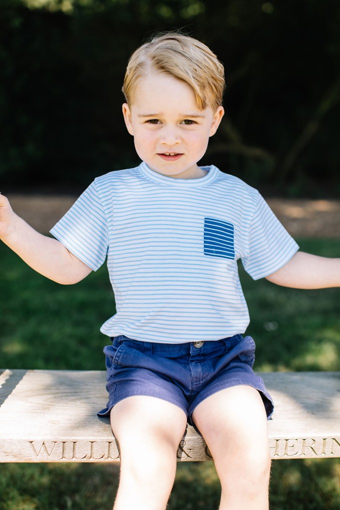 Prince George smiling on a swing