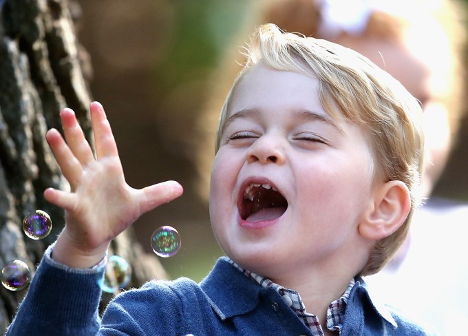 Prince George laughs and enjoys bubbles