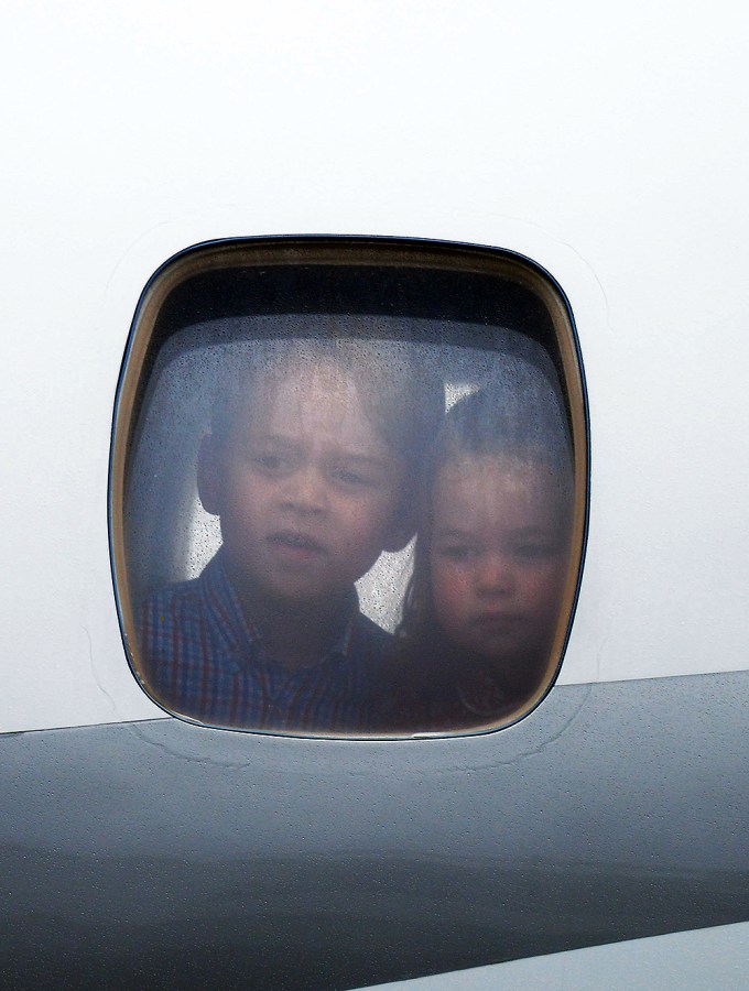 Prince George and Princess Charlotte look out the window
