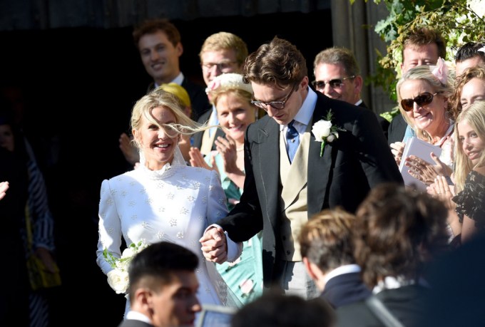 Ellie Goulding and Caspar Jopling hold hands at their wedding