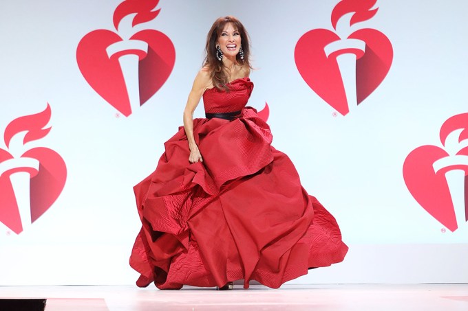 Susan Lucci on the catwalk in a red gown.