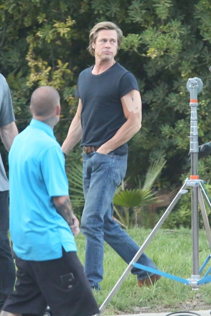 Brad Pitt Showing Muscles On A Movie Set