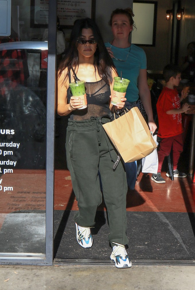 Kourtney Kardashian Grabs Green Juices In Sheer Tank