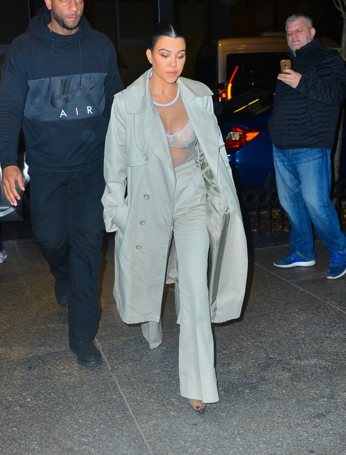 Kourtney Kardashian Pairs Sheer Top With Pantsuit