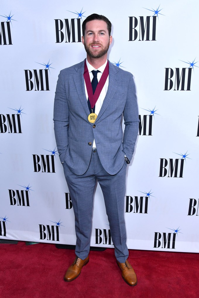 Proudly Wearing BMI Award Around His Neck
