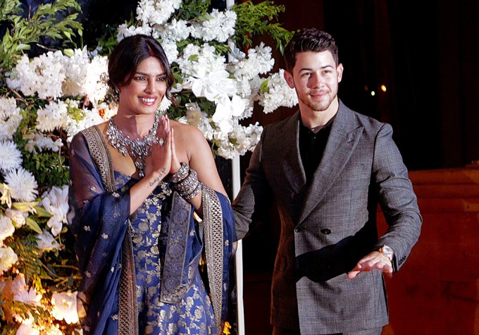 Nick Jonas and Priyanka Chopra pose for photos during their reception