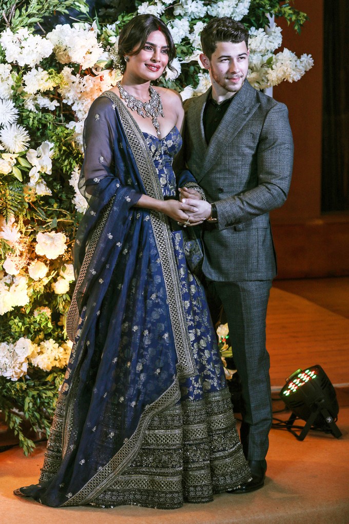 Nick Jonas and Priyanka Chopra pose for wedding reception photos
